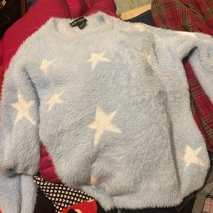 Furry and soft sky blue sweater with stars, wore just a couple of times!